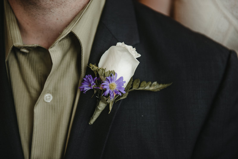 aster rose boutonniere 